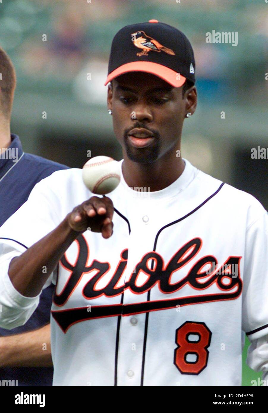 Entertainer/comedian Chris Rock flips a baseball while filming a scene from  his upcoming movie "Head of State" prior to the Baltimore Orioles' game  against the Toronto Blue Jays at Camden Yards, August