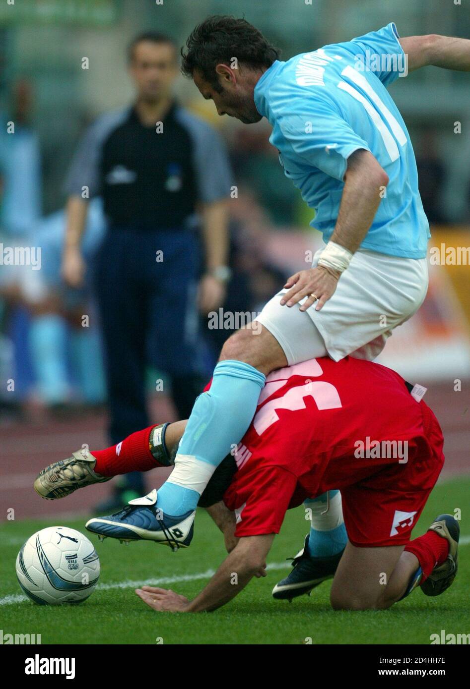 LAZIO'S SINISA MIHAJLOVIC TACKLES MARCO MARCHIONNI OF PIACENZA FOR THE BALL AND MATTEO ABATE OF PIACENZA DURING THEIR SERIE A MATCH. Stock Photo