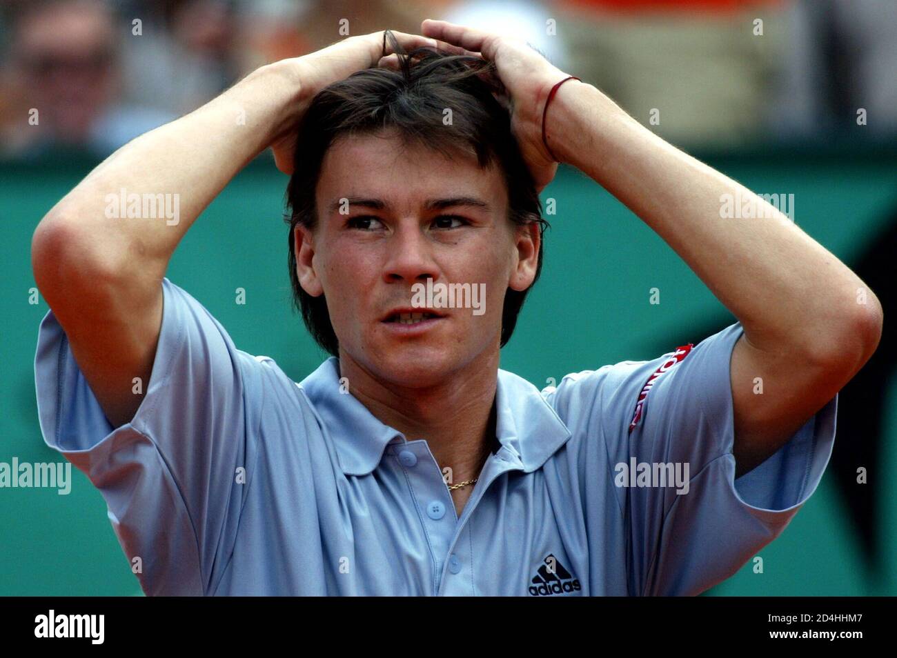 Guillermo Coria Of Argentina Holds His Head After His Racket Hits A Ball Boy During His Match Against Martin Verkerk Of The Netherlands In The Semi Final Of The French Open At Roland