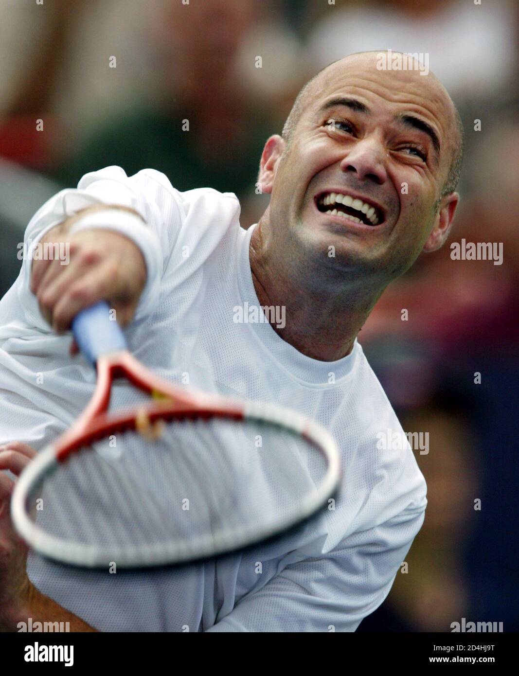 Andre Agassi from the U.S. serves to Simon Larose from Canada during their  third round match at the Tennis Masters Canada Series in Montreal, August  7, 2003. Agassi, the tournament's number one