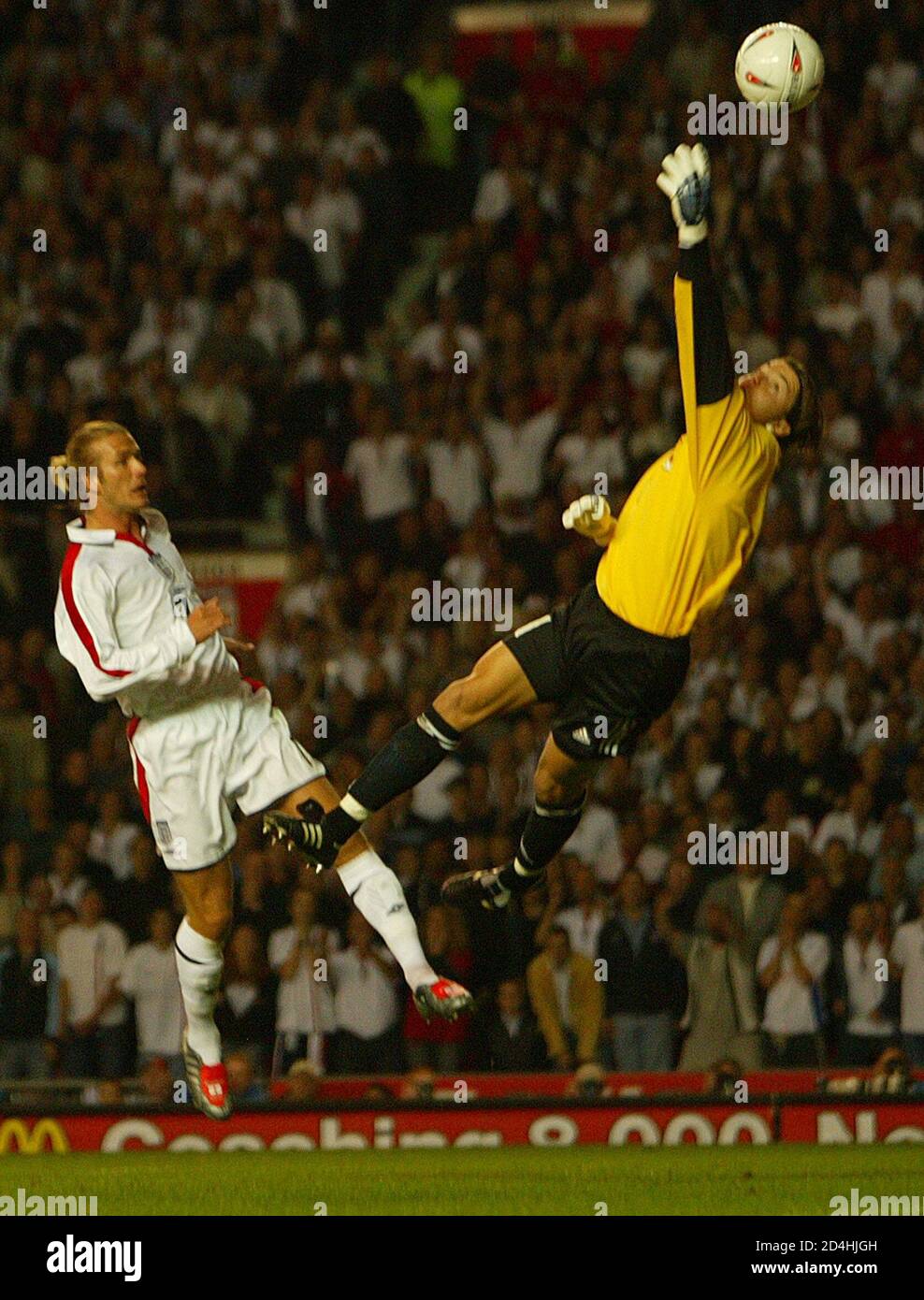 England's David Beckham (L) forces an early save from Liechtenstein's keeper Peter Jehle during their Euro 2004 Championship Group Seven qualifier at Old Trafford, in Manchester September 10, 2003. REUTERS/Ian Hodgson  RUS/AA Stock Photo
