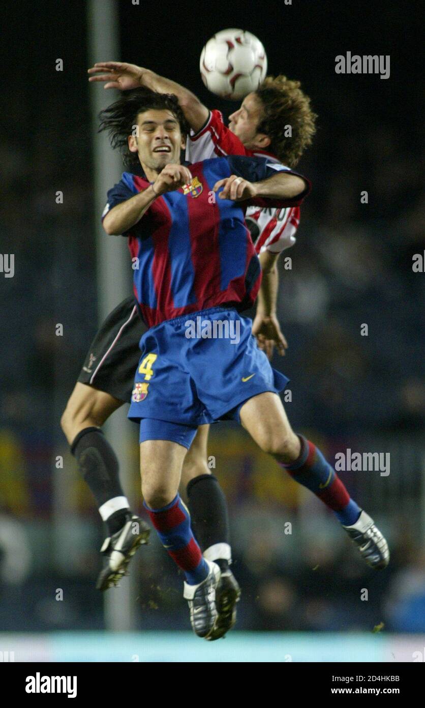 FC Barcelona's Rafael Marquez from Mexico (L) battles for the ball against  Athletic Club de Bilbao Ezquerro (R) during the Spanish First Division  soccer match in Barcelona Nou Camp stadium January 17,