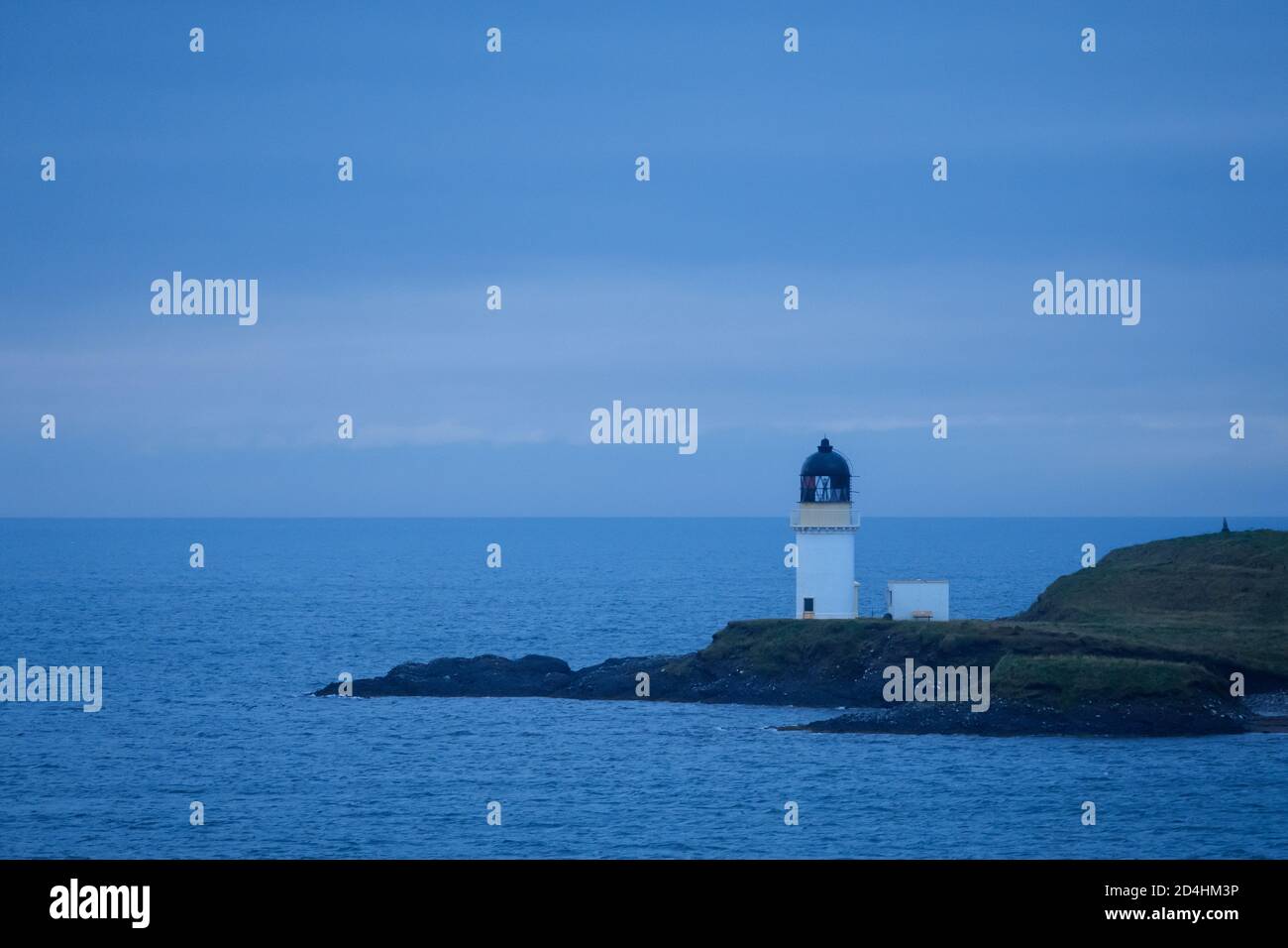 The Arnish Point lighthouse at the entrance to Stornoway Harbour. Stock Photo