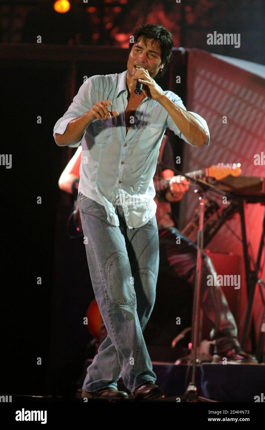 Puerto Rican singer Chayanne performs during a concert at the Soccer Stadium in Managua, July 4, 2004. Chayanne is in Nicaragua as part of a Central American tour. PHOTO TAKEN JULY 4 REUTERS/Oswaldo Rivas  OR/GAC Stock Photo