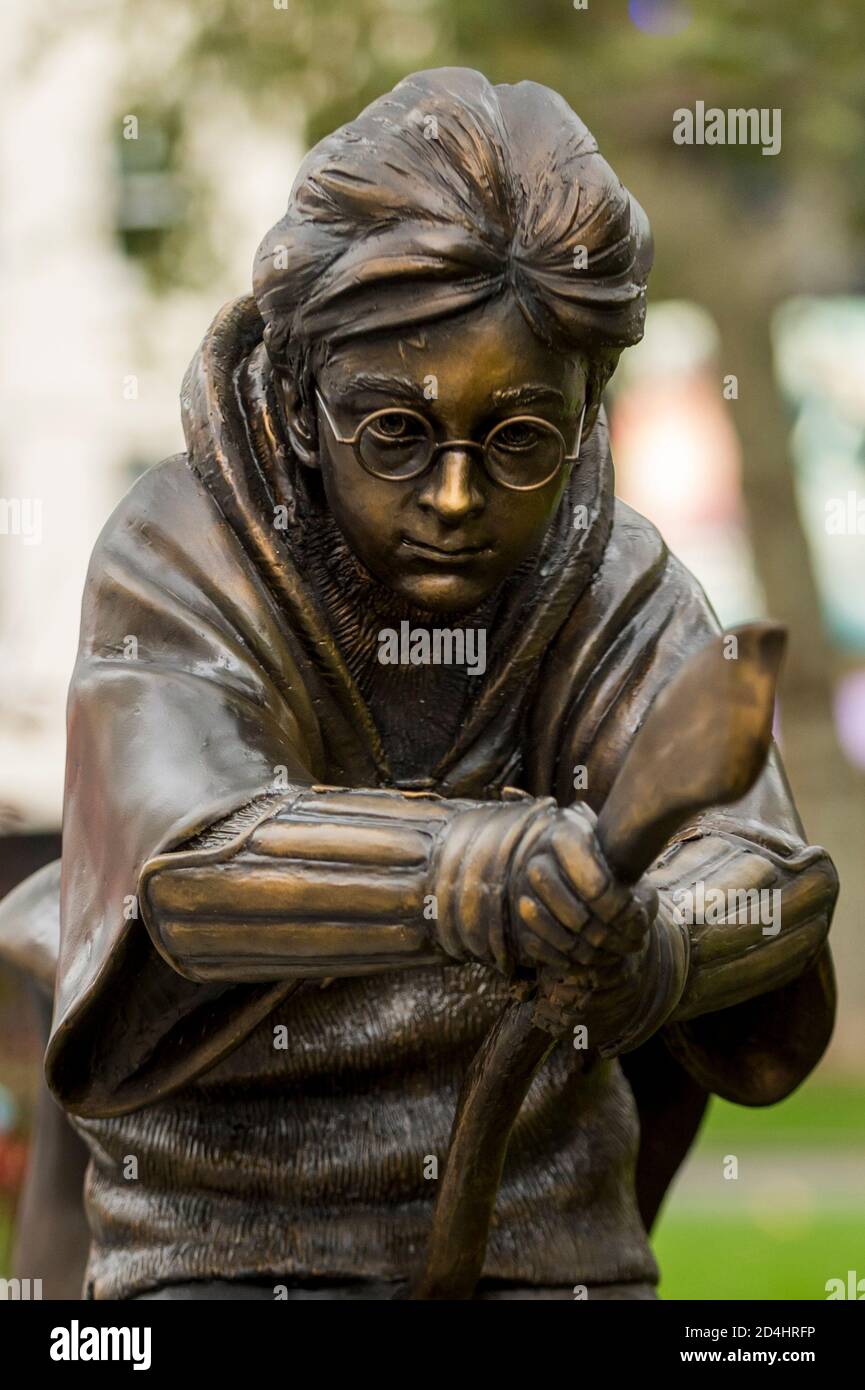 London, UK,  9 October 2020.  A statue depicting Daniel Radcliffe as the character Harry Potter riding his Nimbus 2000 during his debut Quidditch match in the film Harry Potter and the Philosopher’s Stone has been unveiled in Leicester Square.  It joins statues of several other movie characters in a series known as Scenes in the Square.  As a treat for movie fans, the nearby Odeon Luxe cinema is screening all of the Harry Potter movies back catalogue 9 to 14 October.   Credit: Stephen Chung / Alamy Live News Stock Photo