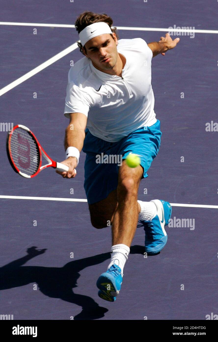 Roger Federer of Switzerland hits a volley to Lleyton Hewitt of Australia  during the men's final of the Pacific Life Open in Indian Wells,  California, March 20, 2005. Federer, the defending champion,