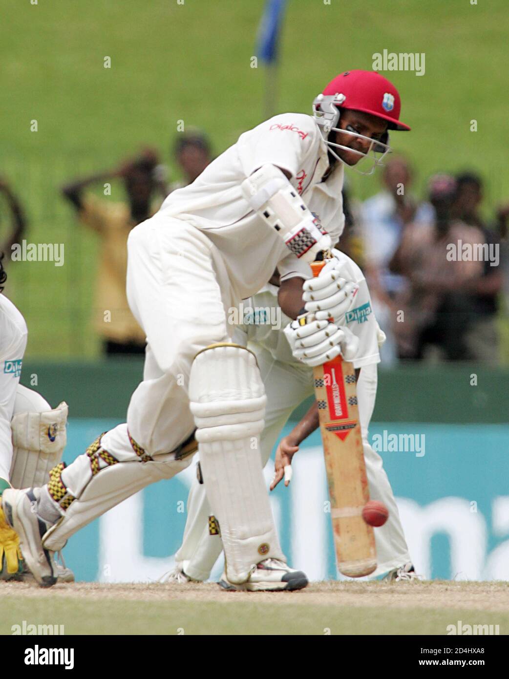 West Indies' batsman Shivnarine Chanderpaul hits a boundary against Sri Lanka during their fourth day of first test cricket match in Colombo, Sri Lanka July 16, 2005. Sri Lanka, chasing 172 for victory, were 25 without loss at lunch on the fourth day of the first test against West Indies on Saturday. Earlier, Muttiah Muralitharan had taken 6-36 to skittle out the West Indies for 113. REUTERS/Anuruddha Lokuhapuarachchi  AL/JJ Stock Photo