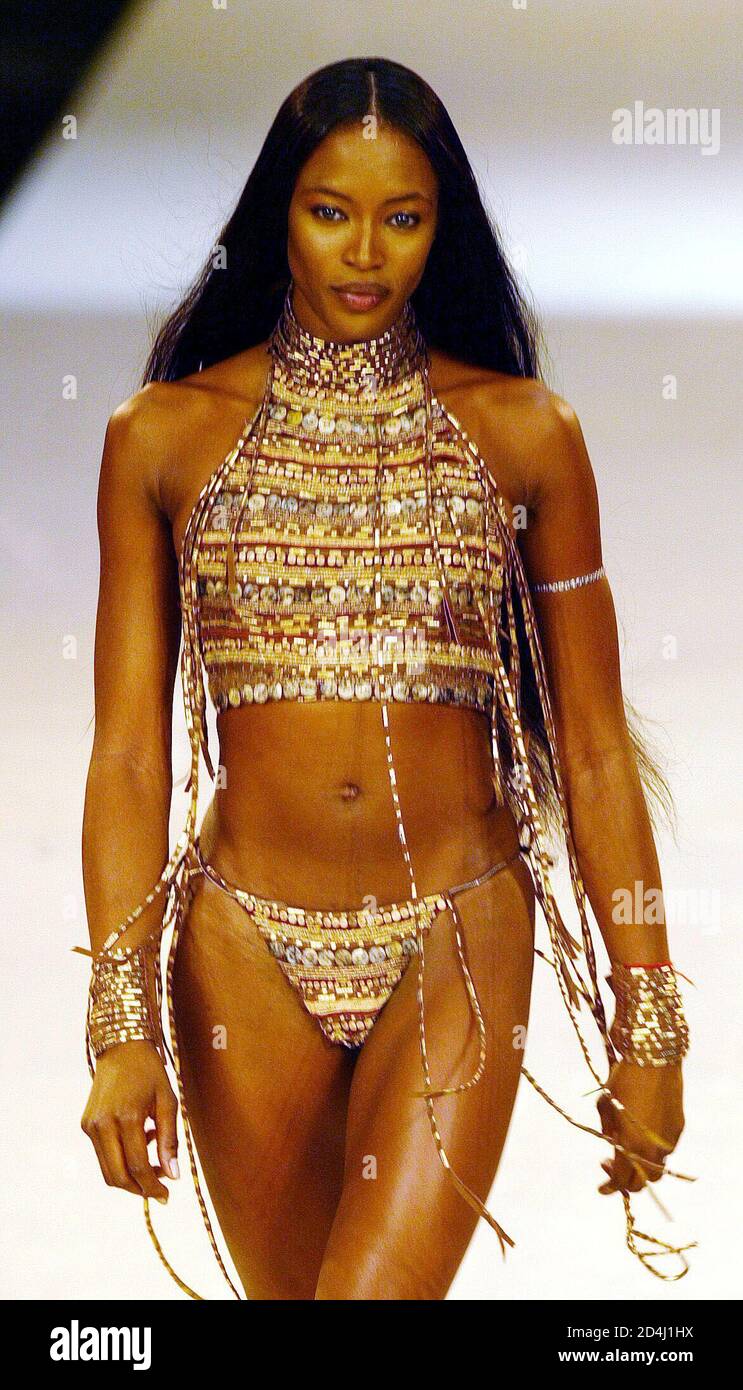 British top model Naomi Campbell presents a creation from Lenny's  Spring/Summer 2003 collection at the Rio de Janeiro Fashion Week July 24,  2002. Rio de Janeiro Fashion Week runs until July 26