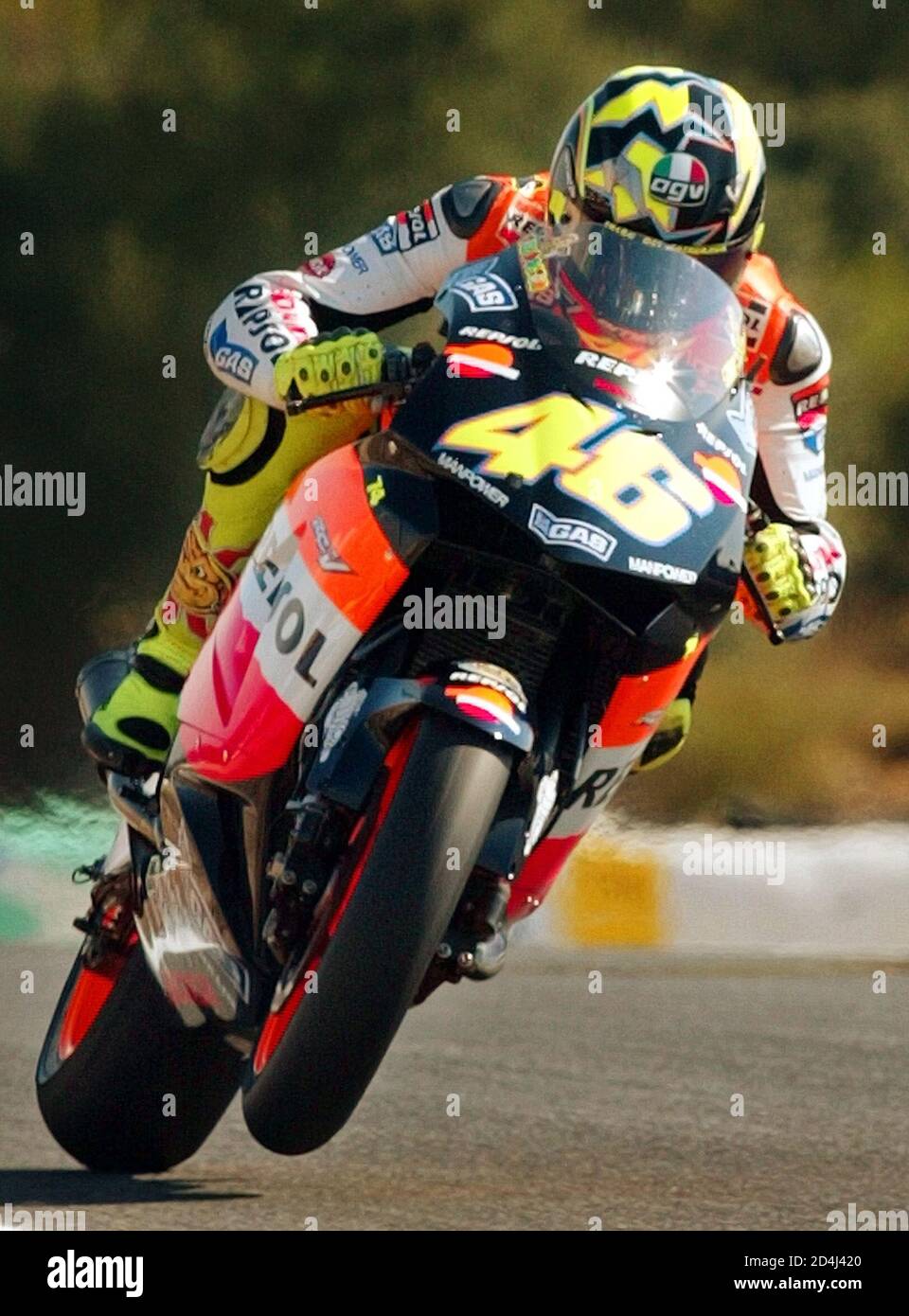 Italian rider Valentino Rossi on a Honda GP motorbike comes out from a  curve during the first free practice session at the Estoril circuit in  Portugal September 5, 2003. Valentino Rossi clocked
