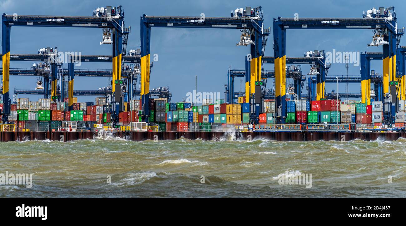 Stormy weather for British Trade - waves crash against Felixstowe Docks. The Port of Felixstowe is the UK's largest container port. Stock Photo