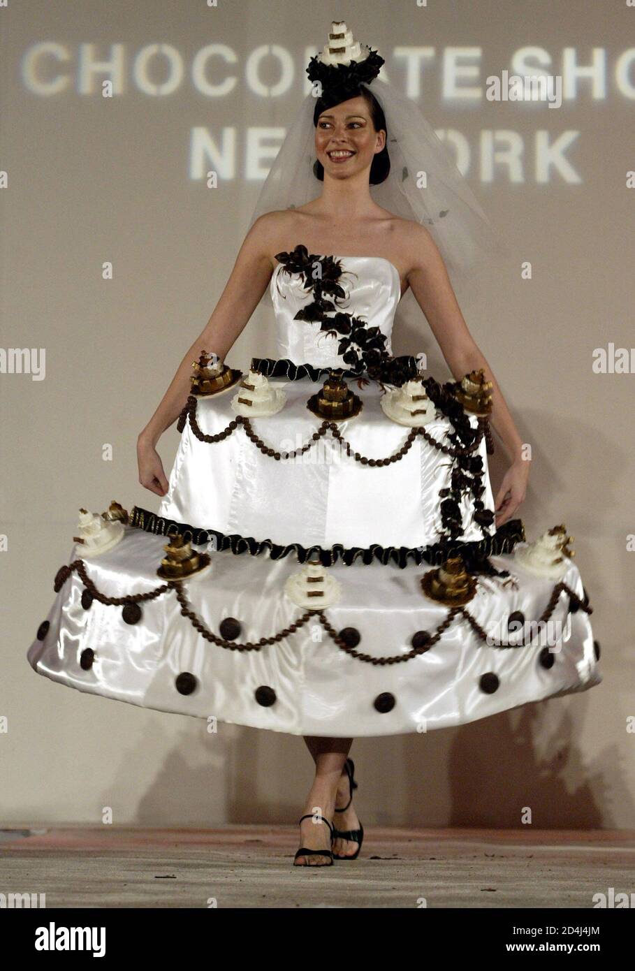 A model walks down the runway wearing a chocolate inspired dress during the  Chocolate Show in New York November 12, 2003. The Chocolate Show combines  chocolate and fashion by pastry chefs and