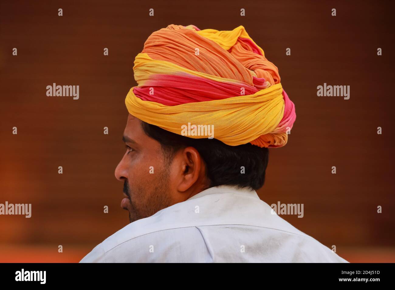 A Selective focus  Abstract side portrait of a Rajasthani man wearing a colorful turban at Jaipur,  Rajasthan India on 01 November 2017 Stock Photo