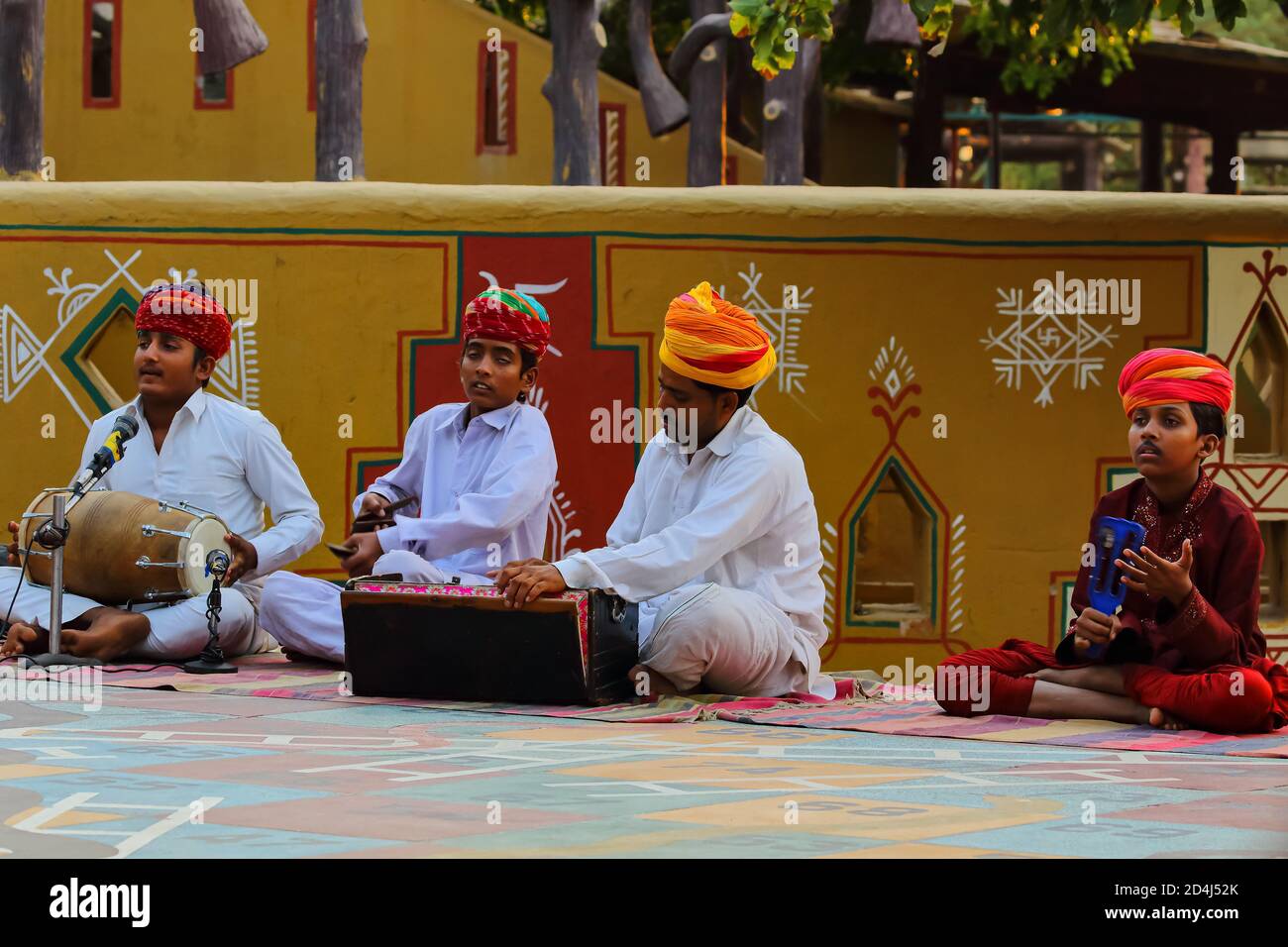 Rajasthani men dressed in traditional attire playing folk music at Jaipur Rajasthan, India on 01 November 2017 Stock Photo