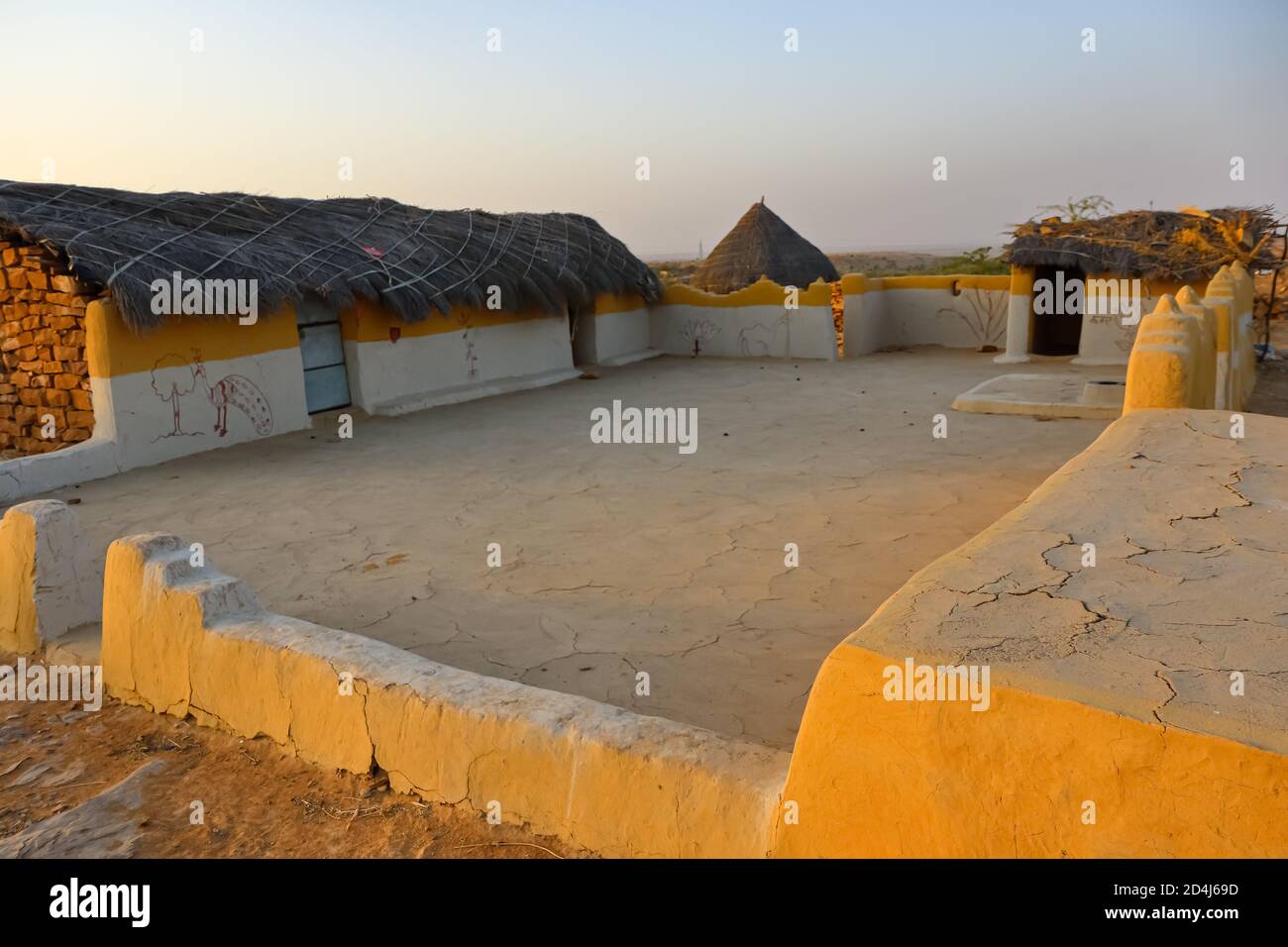 A selective focus image of a mud house with thatched roof in an village in Rajasthan India Stock Photo