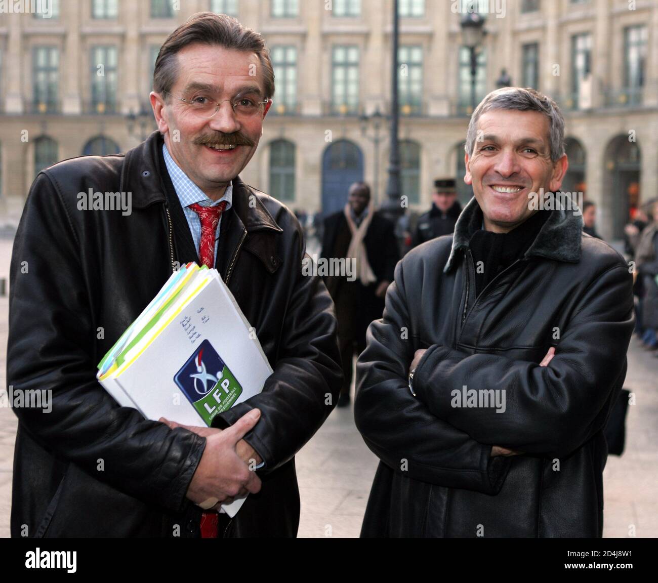 Frederic Thiriez, head of France's soccer professional Ligue (L) poses with  Louis Multari head of Corsican club Bastia before a meeting with French  Justice Minister Dominique Perben in Paris, December 21, 2004.