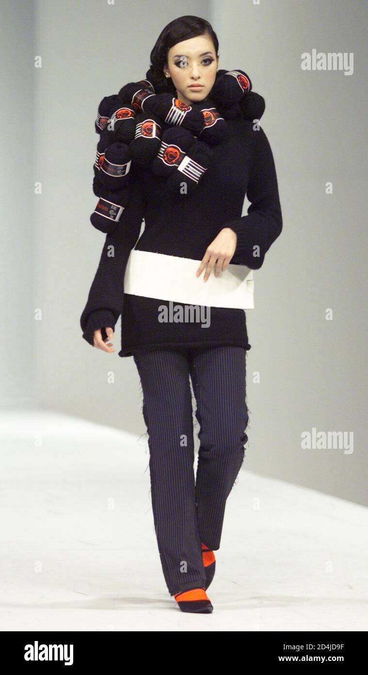 A model for Hong Kong designer Baldwin Pui presents a creation at the Hong Kong Fashion Week for Fall/Winter 2001 January 18, 2001. More than 800 local and foreign exhibitors participate in the four-day long exhibition. Stock Photo
