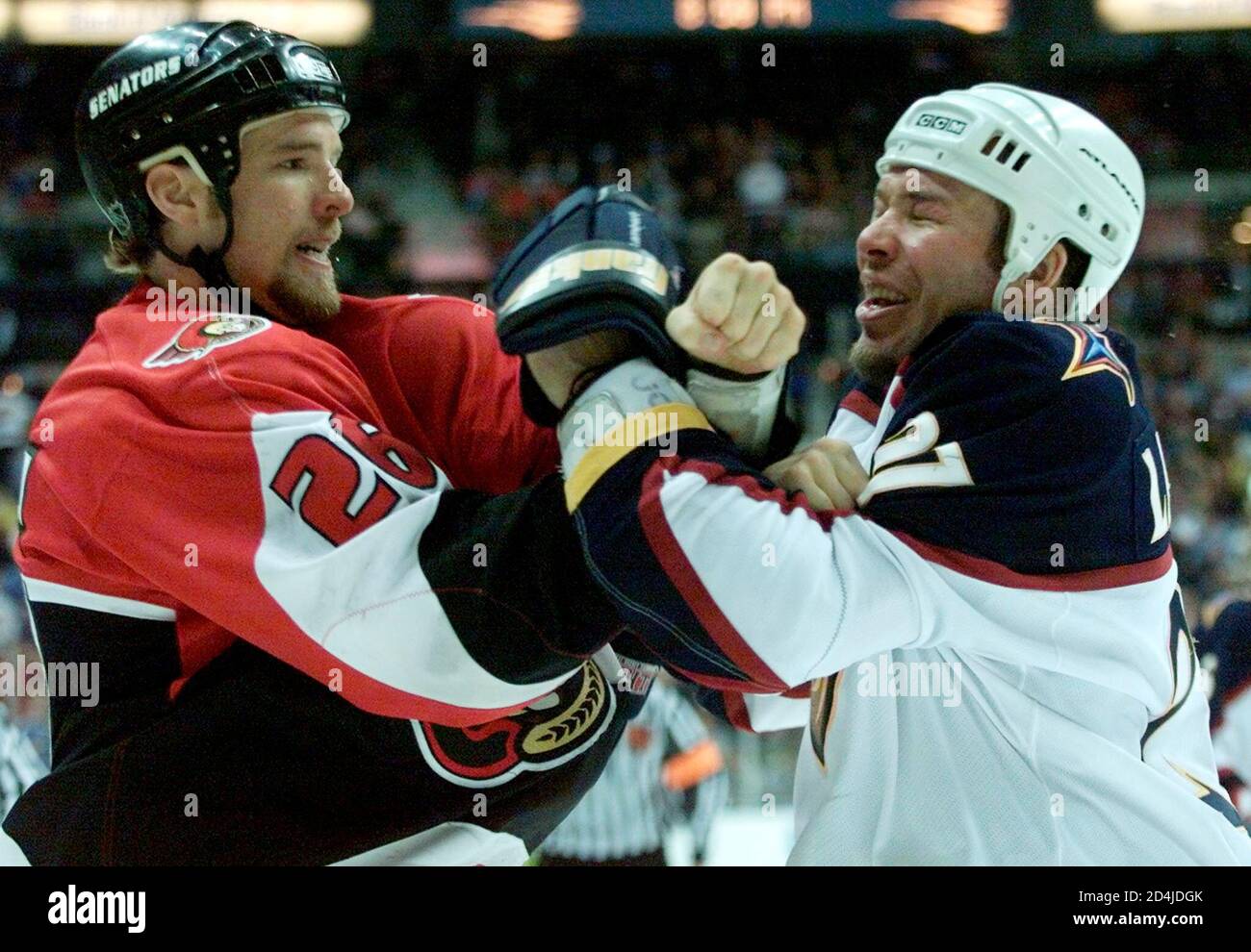 Ottawa Senators right wing Andre Roy (L) punches Atlanta Thrashers Denny  Lambert (R) as they fought in the second period of NHL action at Philips  Arena in Atlanta on April 3, 2001.