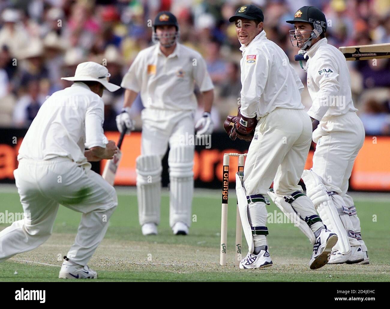 South Africa S Shaun Pollock L Catches Australia S Justin Langer R For 116 Runs As Wicket Keeper Mark Boucher And Australia S Damien Martyn 2nd From Left Look On During The First Day S Play In