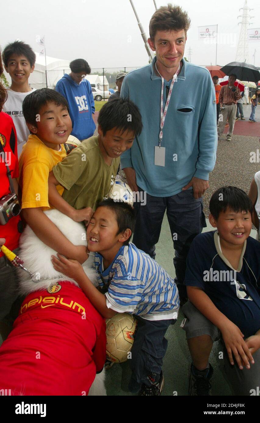 Belgian Singer Koen Wauters Up Stands Between Japanese Children Between Outside Kk Wing Stadium In Kumamoto May 30 02 Wauters Will Give A Concert Later Today For The Belgium S Team Playing In