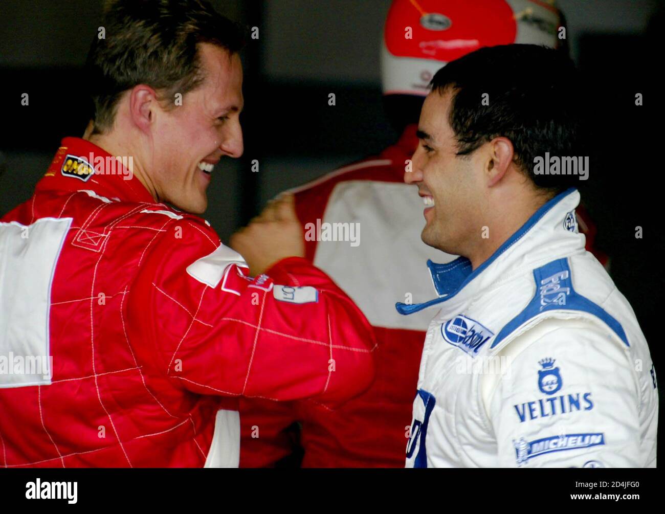 Colombian Formula One Racing Driver Juan Pablo Montoya Of Williams R Is Congratulated By Ferrari S German Driver Michael Schumacher After Finishing In Pole Position For The British Grand Prix On July 6