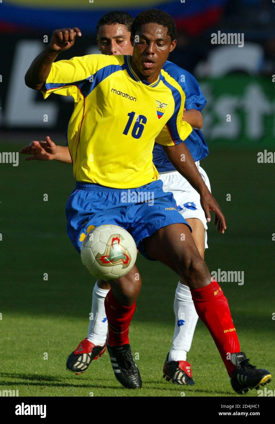 Ecuador's Cleber Chala runs with the ball followed by Colombia's Giovanni  Hernandez during a friendly international match in Madrid's Vicente  Calderon stadium June 8, 2003. The match ended in a 0-0 draw.