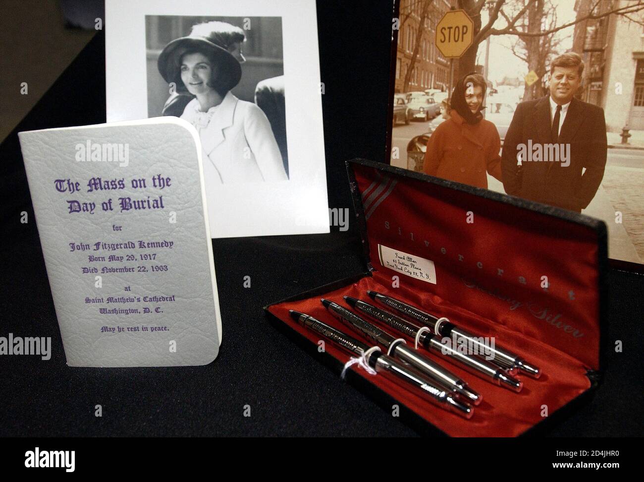 Photographs, pens and a booklet from the final memorial for JFK on display as part of the items for auction belonging to President and Mrs. Kennedy on July 18, 2003.    auction, at Dawson's Auctioneers & Appraisers in Morris Plains, New Jersey, will include more than 300 items ranging from the whimsical, [World War II Navy-issue boxer shorts, with the sown label, 'Jack Kennedy', to the historic, a personal presidential campaign notebook.] Stock Photo