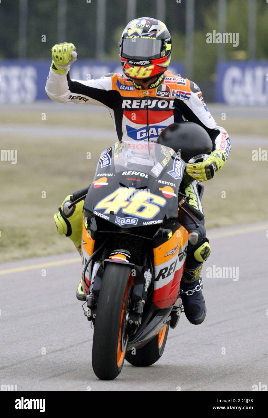 Valentino Rossi of Italy celebrates his victory of the MotoGP motorcycling  race of the Czech Republic Grand Prix in Brno August 17, 2003. Rossi won  today clocking the time of 44 minutes