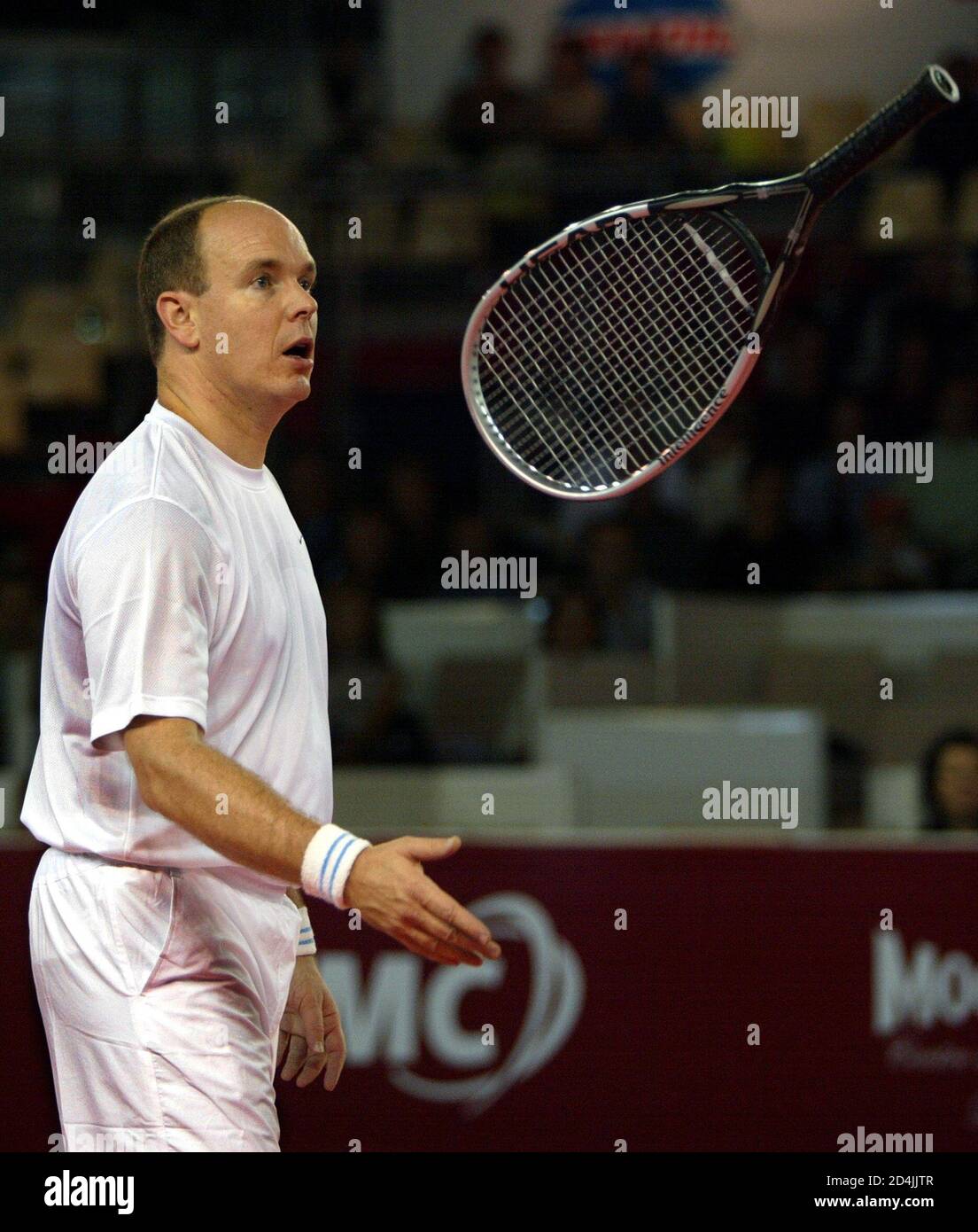 Prince Albert of Monaco throws his racketat the ATP senior tour champion  legends of Monte Carlo tournament, in Monaco November 22, 2003. Prince  Albert played a doubles match with former U.S. tennis