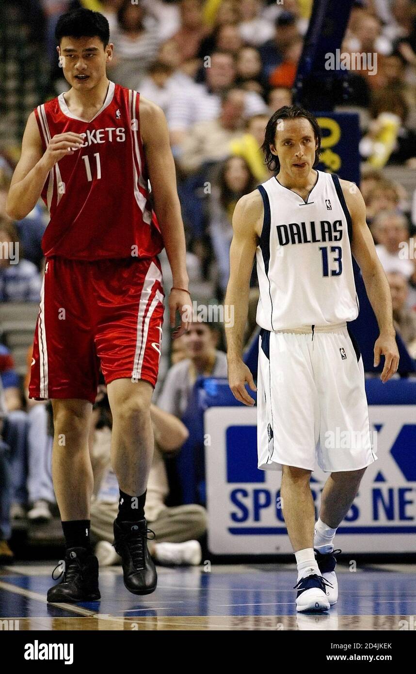 Houston Rockets center Yao Ming (L) and Dallas Mavericks guard Steve Nash  walk down court during first half action at the American Airlines Center in  Dallas, Texas, February 21, 2004. REUTERS/Jeff Mitchell