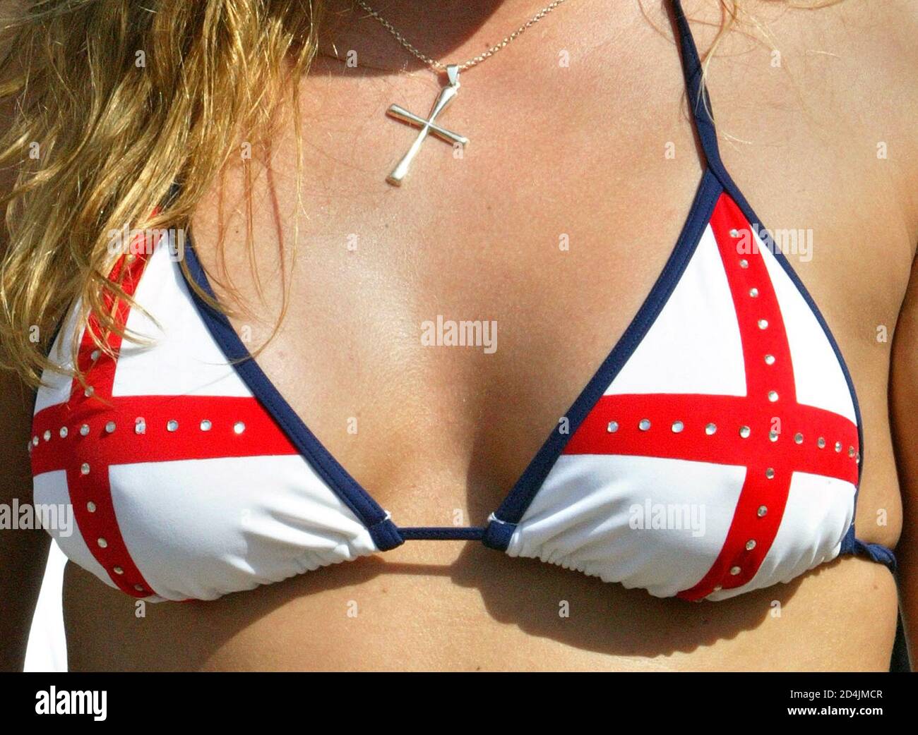An England soccer fan wears a Cross of St George bikini top in the centre  of Lisbon, June 13, 2004. England will play France in their Euro 2004 Group  B soccer match.