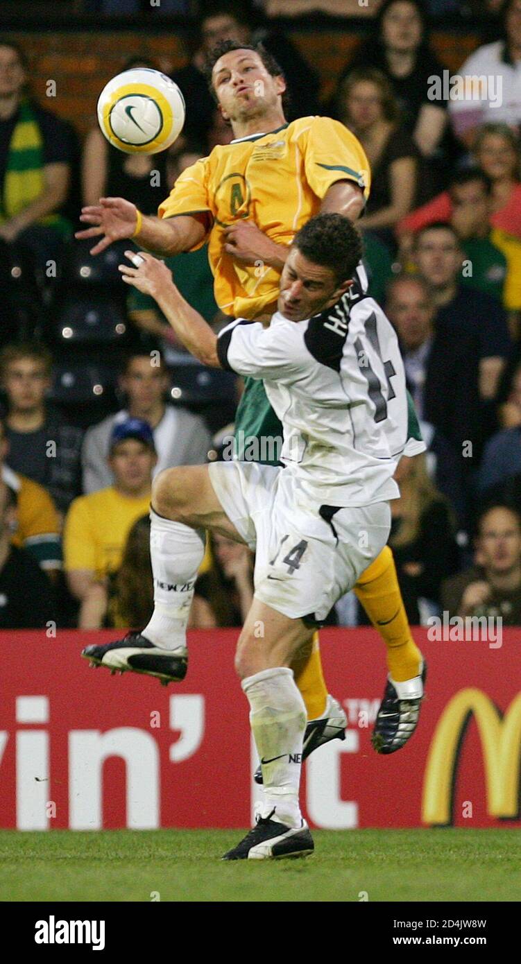Australia's Lucas Neill challenges New Zealand's Noah Hickey during their international friendly soccer match at Craven Cottage, Fulham, London June 9, 2005. REUTERS/Eddie Keogh  EK/RD Stock Photo
