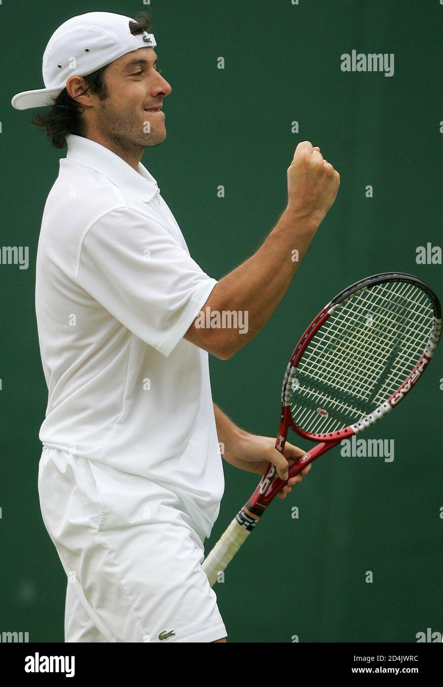 Sebastien Grosjean of France celebrates defeating Serbia and Montenegro's  Novak Djokovic during his third round match against at the Wimbledon tennis  championships in London, June 25, 2005. Grosjean won the match 7-5