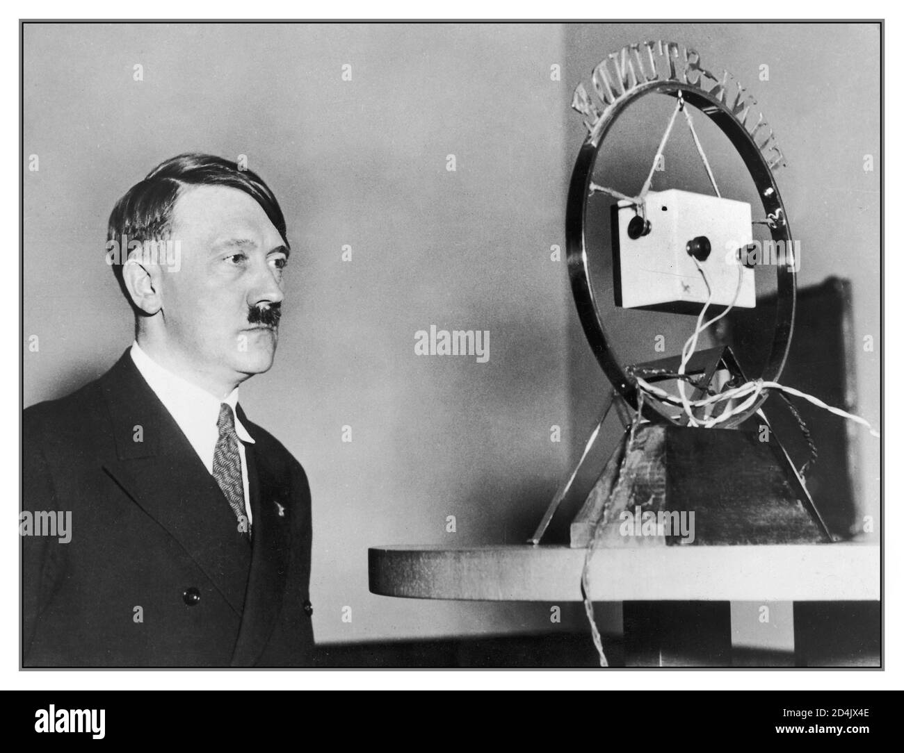 1930's Adolf Hitler addresses the German nation by radio broadcast transmission. On February 1, 1933, two days after he was appointed chancellor, Hitler spoke over the radio to the German people about his vision for the future of the country: Hitler ended his broadcast with 'Let us begin, loyal to the command of the Field-Marshal. May Almighty God favor our work, shape our will in the right way, bless our vision and bless us with the trust of our people. We have no desire to fight for ourselves; only for Germany. Stock Photo