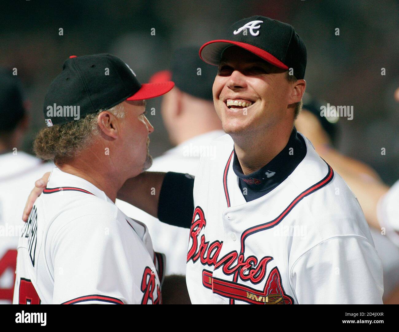 Atlanta Braves Chipper Jones (R) celebrates with first base coach Glenn  Hubbard after the Braves beat the Washington Nationals 3-2 in 10 innings in  Atlanta, Georgia July 26, 2005. With the win,
