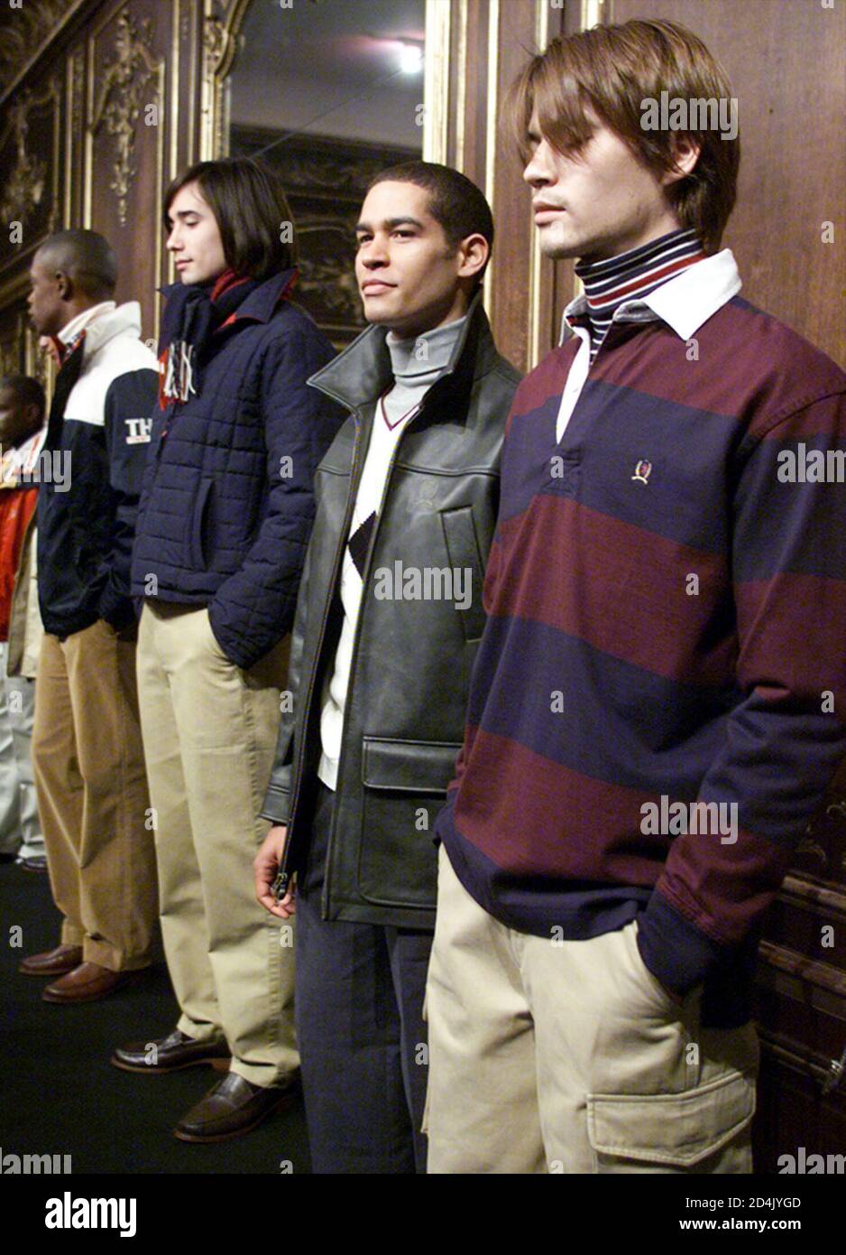 Designer Tommy Hilfiger's Men's Fall 2001 presentation, shown in New York  on February 8, 2001, "celebrates his long 'love story' with collegiate prep  and Ivy League style." Model Makoto (R) wears a