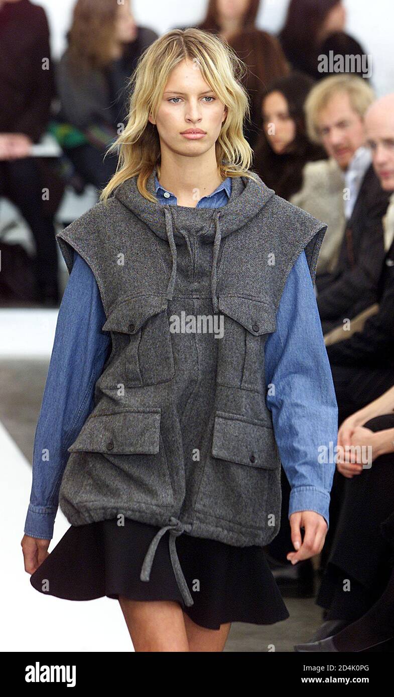 A model wears a gray vest with a blue shirt and black skirt at the Balenciaga  Fall 2002 fashion show in New York on February 13, 2002 Stock Photo - Alamy