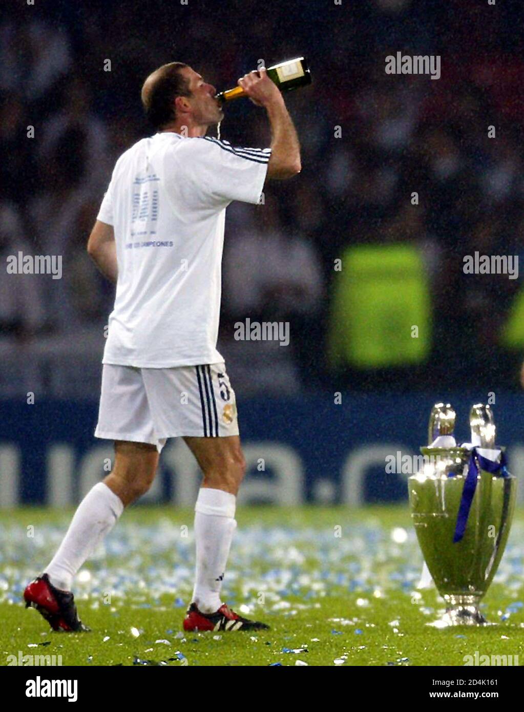 Real Madrid's Zinedine Zidane celebrates winning the Champions League final  against [Bayer Leverkusen] by drinking champagne at Hampden Park stadium in  Glasgow May 15, 2002. Real Madrid won the match 2-1. Zidane