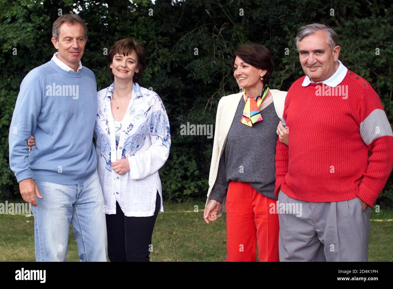 British prime Minister Tony Blair (L) and his wife Cherie pose with French prime Minister Jean-Pierre Raffarin (R) and his wife Anne-Marie during a private meeting at Lagrezette chateau in Caillac, southwestern France, August 12, 2002. Blair and Raffarin interrupted their holidays to meet for informal talks, with police saying the meeting was 'strictly private'. REUTERS/Jean-Philippe Arles  JPA/CRB Stock Photo