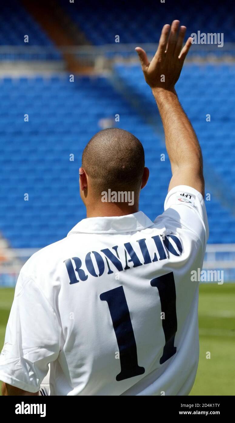 Real Madrid's new Brazilian star Ronaldo waves to supporters during his  presentation ceremony at Santiago Bernabeu stadium September 2, 2002. The  Brazilian striker, who has signed a four-year contract for the club,