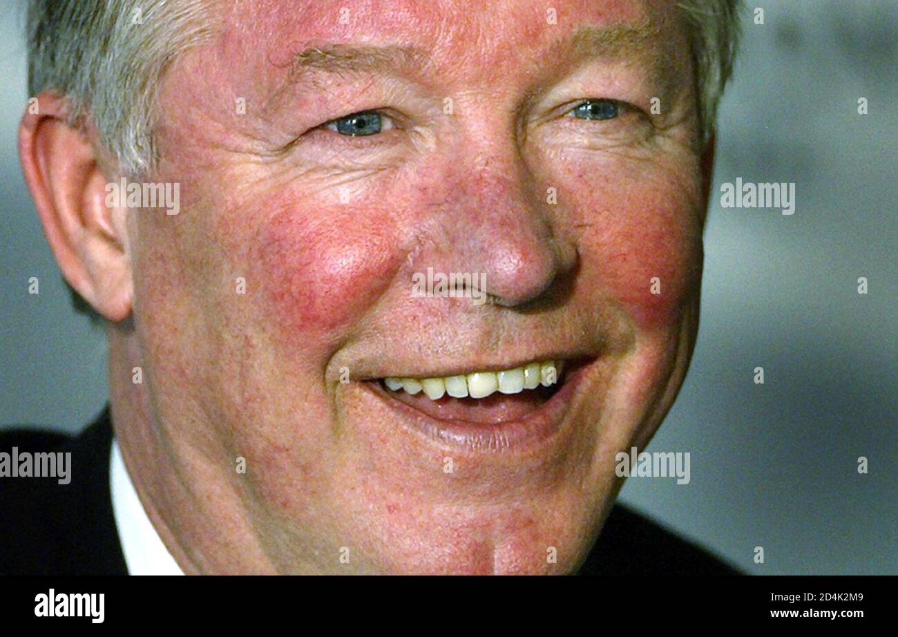 Manchester United's manager Sir Alex Ferguson talks to the media during a  news conference in Turin, Italy, February 24, 2003. [Manchester United will  face Juventus in their Champions League group D match