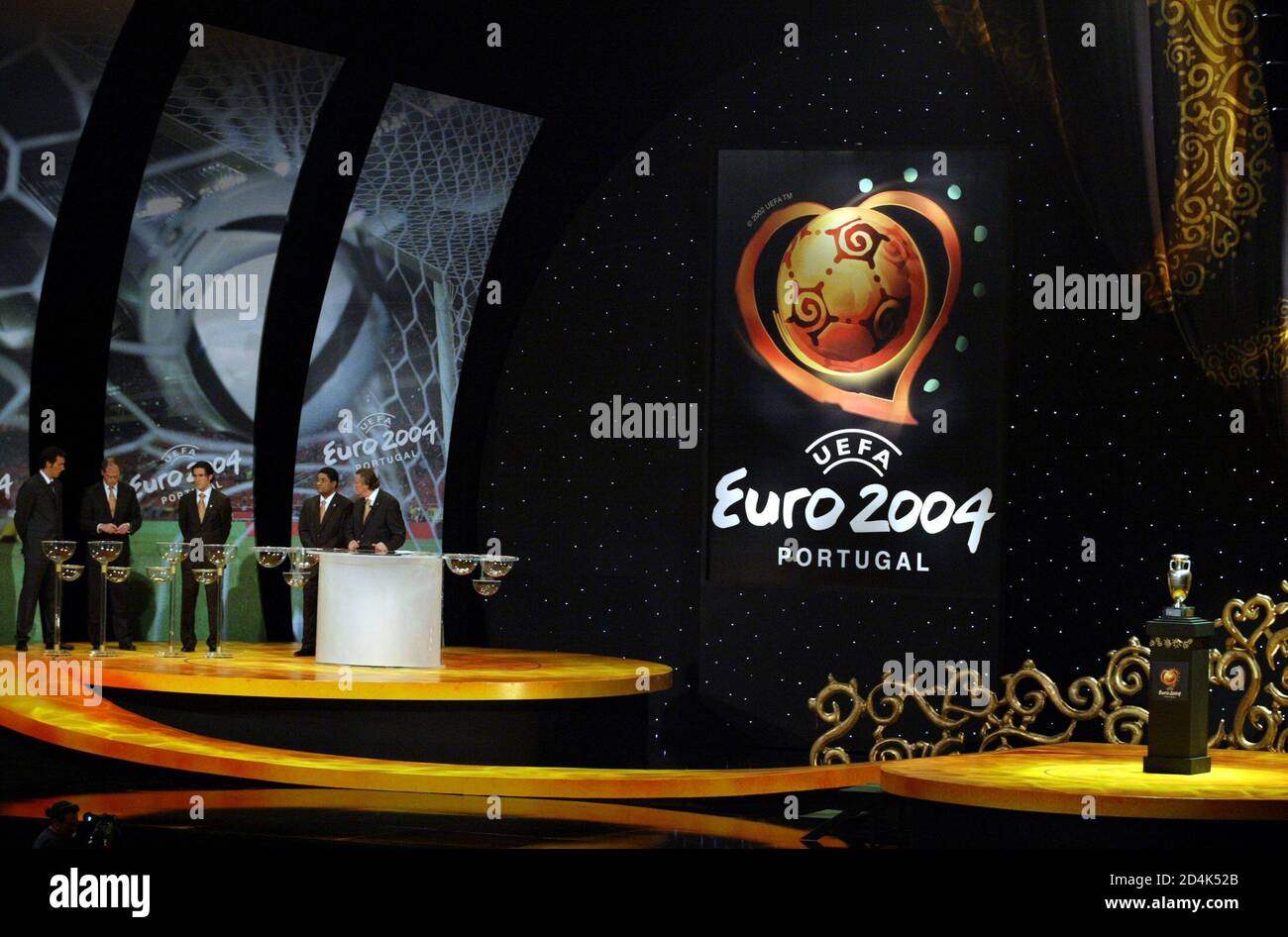 UEFA chief executive Gerhard Aigner (5l) conducts the draw for Euro 2004 in  the Atlantic pavillion in Lisbon November 30, 2003. The European soccer  championships will be staged in Portugal between June