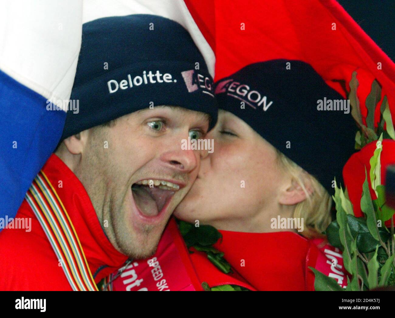Erben Wennemars (L) of the Netherlands gets a congratulatory kiss from  compatriot Marianne Timmer as they celebrate capturing their first titles  at the World Sprint Skating Championship in Nagano, central Japan January