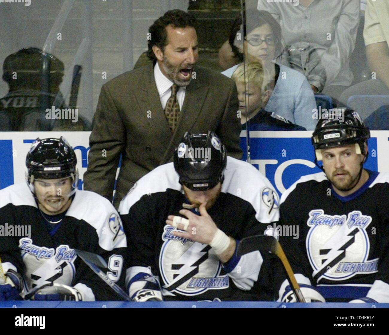 Tampa Bay Lightning head coach John Tortorella (rear) shouts instructions  to players (L-R) Eric Perrin, Chris Dingman and Cory Stillman during their  NHL Eastern Conference Finals Game 2 against the Philadelphia Flyers