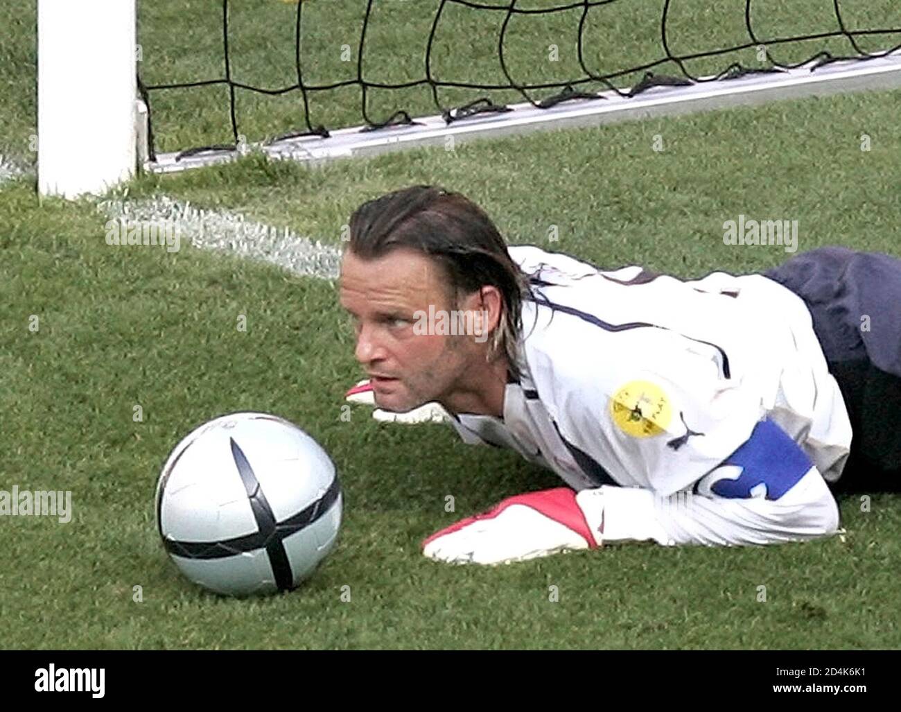 SWITZERLAND'S STIEL STOPS THE BALL WITH HIS HEAD DURING A EURO 2004 SOCCER  MATCH AGAINST CROATIA IN LERIA. Switzerland's goalkeeper Joerg Stiel looks  up after he stopped the ball with his head