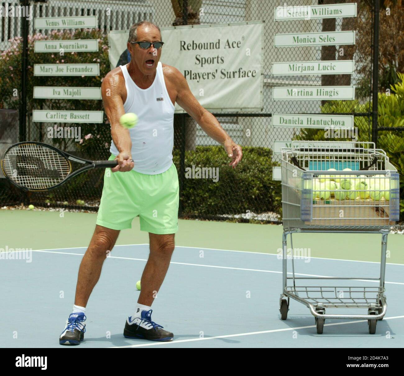 Nick Bollettieri hits the ball during practice with his students at the  Nick Bollettieri Tennis Academy in Bradenton, Florida in July 12, 2004.  Bollettieri Academy as trained passed champions [Andre Agassi, Monica