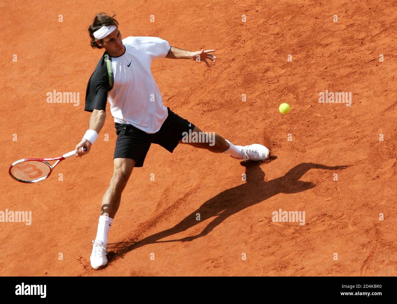 Federer from Switzerland returns ball to Davydenko from Russia during  semifinal match at Hamburg Masters Tennis tournament. Roger Federer from  Switzerland returns a ball to Nikolay Davydenko from Russia in a semifinal