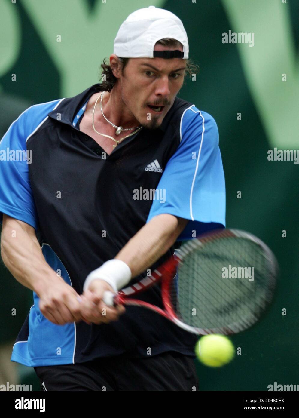 Marat Safin of Russia returns a backhand towards Argentina's Guillermo  Canas during the semi-finals of the Halle Open in Halle. Marat Safin of  Russia returns a backhand towards Argentina's Guillermo Canas during