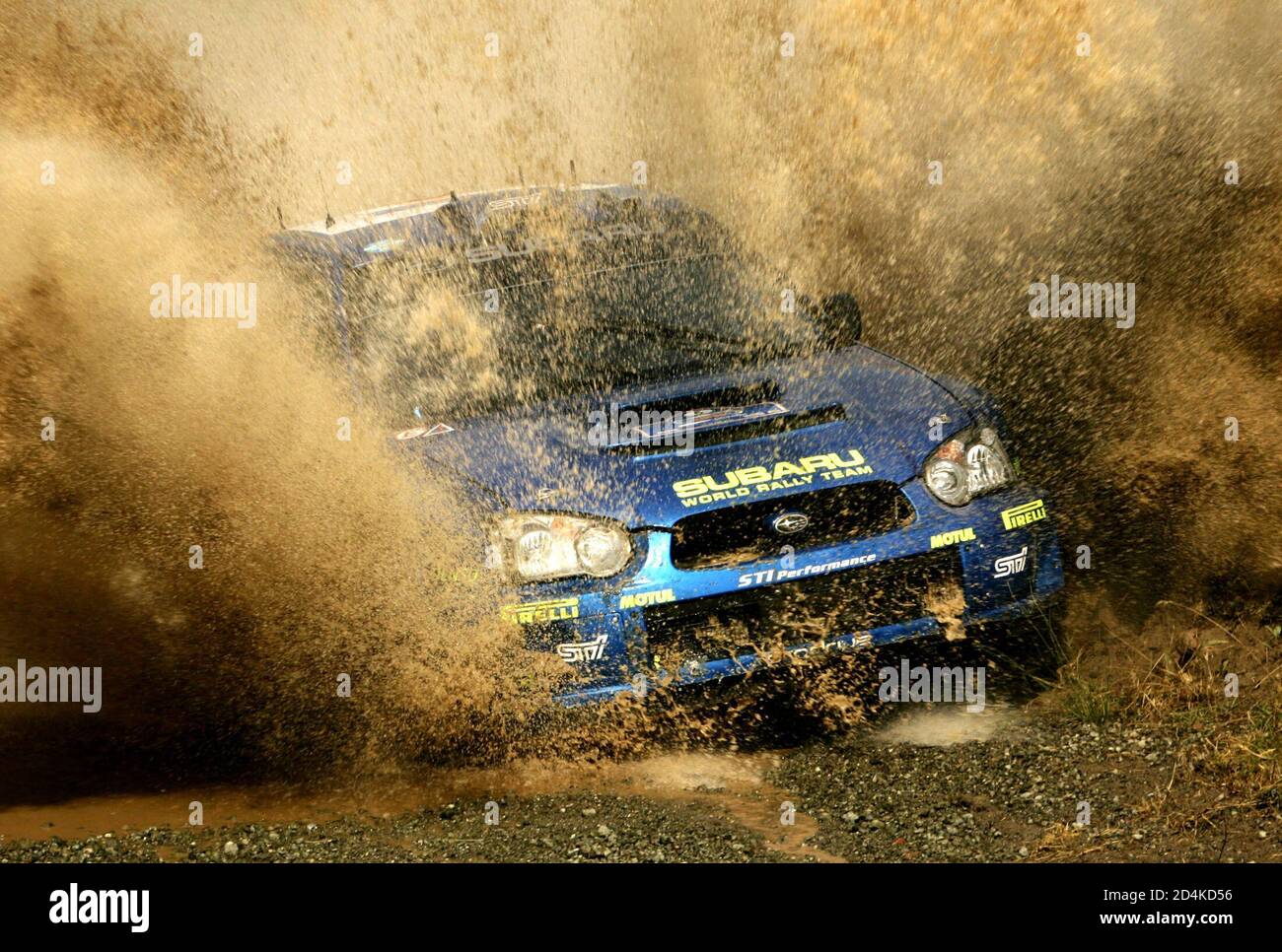 Petter Solberg Of Norway Drives His Subaru Impreza Wrc Through A Water Point During The Regini Special Stage Of The Acropolis Rally Of Greece June 24 05 French Driver Sebastien Loeb Leads