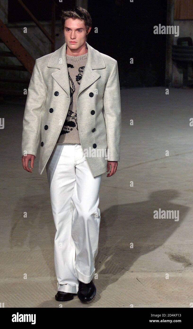 A model presents this double-breasted jacket over an embroidered sweater as  a part of Belgian designer Dries Van Noten's Autumn-Winter 2001-2002 men's  fashion collection in Paris, January 26, 2001. The men's fashion