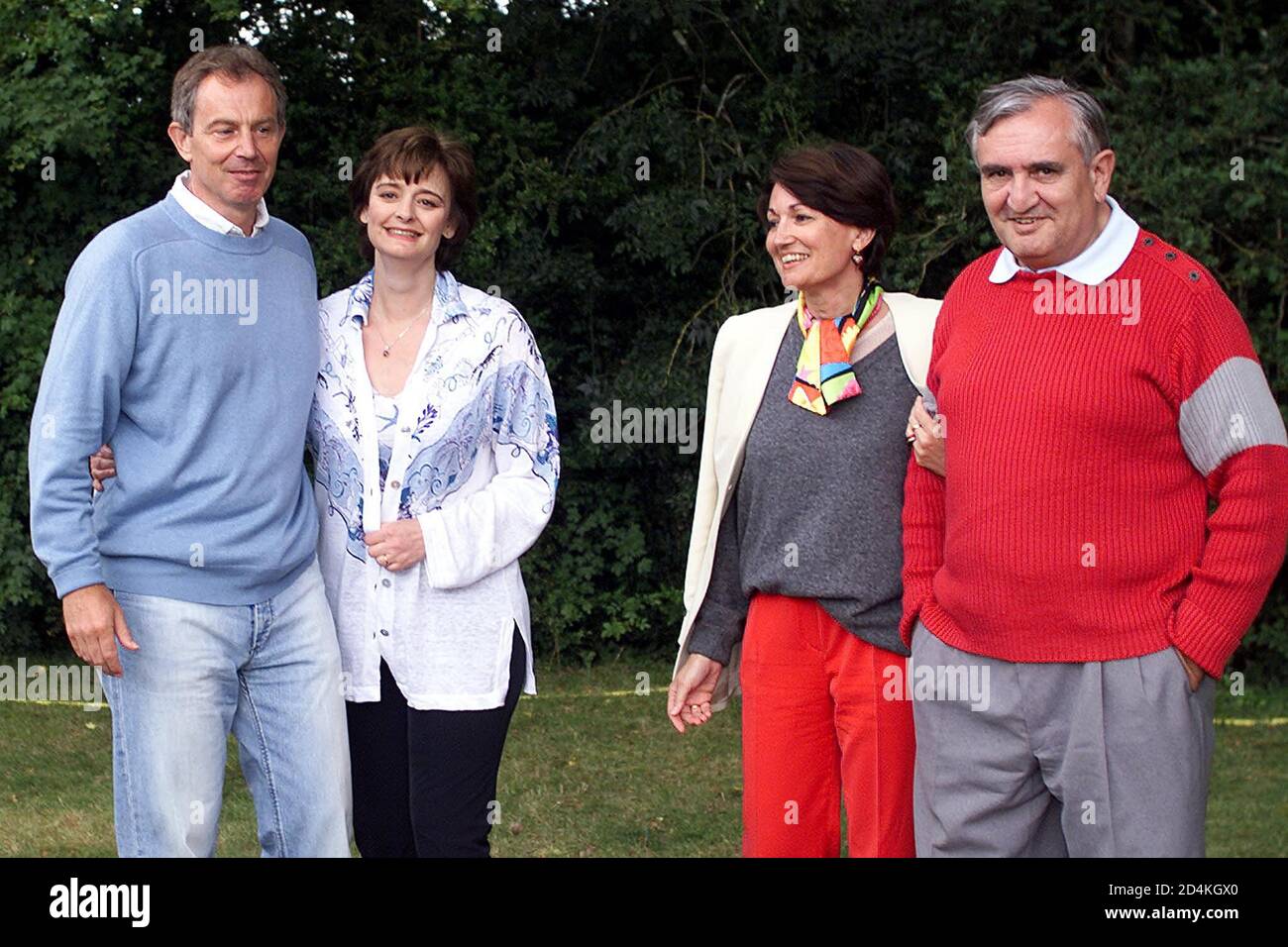 British prime Minister Tony Blair (L) and his wife Cherie pose with French prime Minister Jean-Pierre Raffarin (R) and his wife Anne-Marie during a private meeting in castle of 'Lagrezette' in Caillac, southwestern France, August 12, 2002. Blair is currently on holiday in the area. Stock Photo